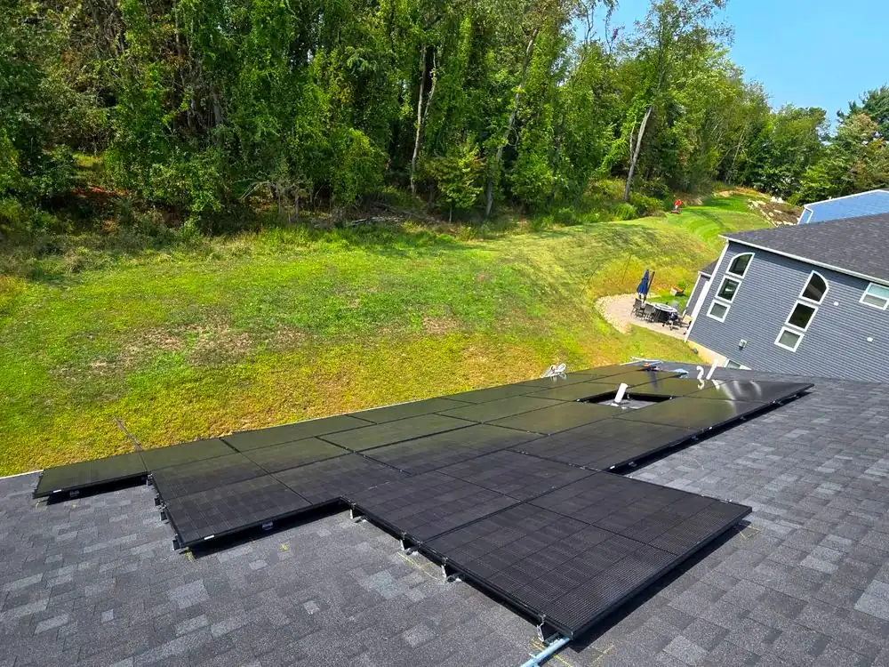 Large roof-mounted solar array photographed from above